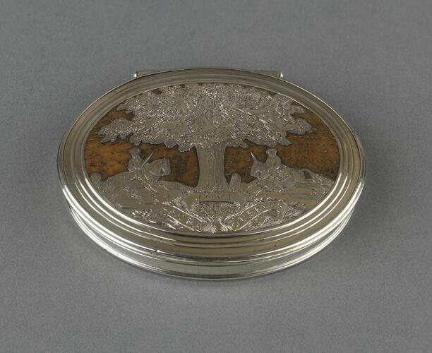 An oval oak and silver snuff box, 1660